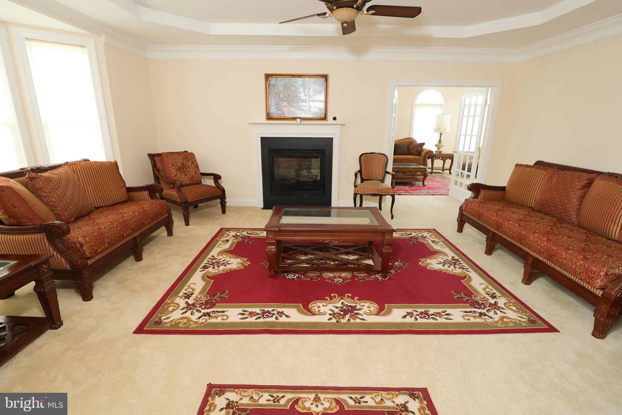 2 Edgewood Drive Pittsgrove, NJ 08318 - Photo 22 of 78 a living room with furniture a rug and a fireplace