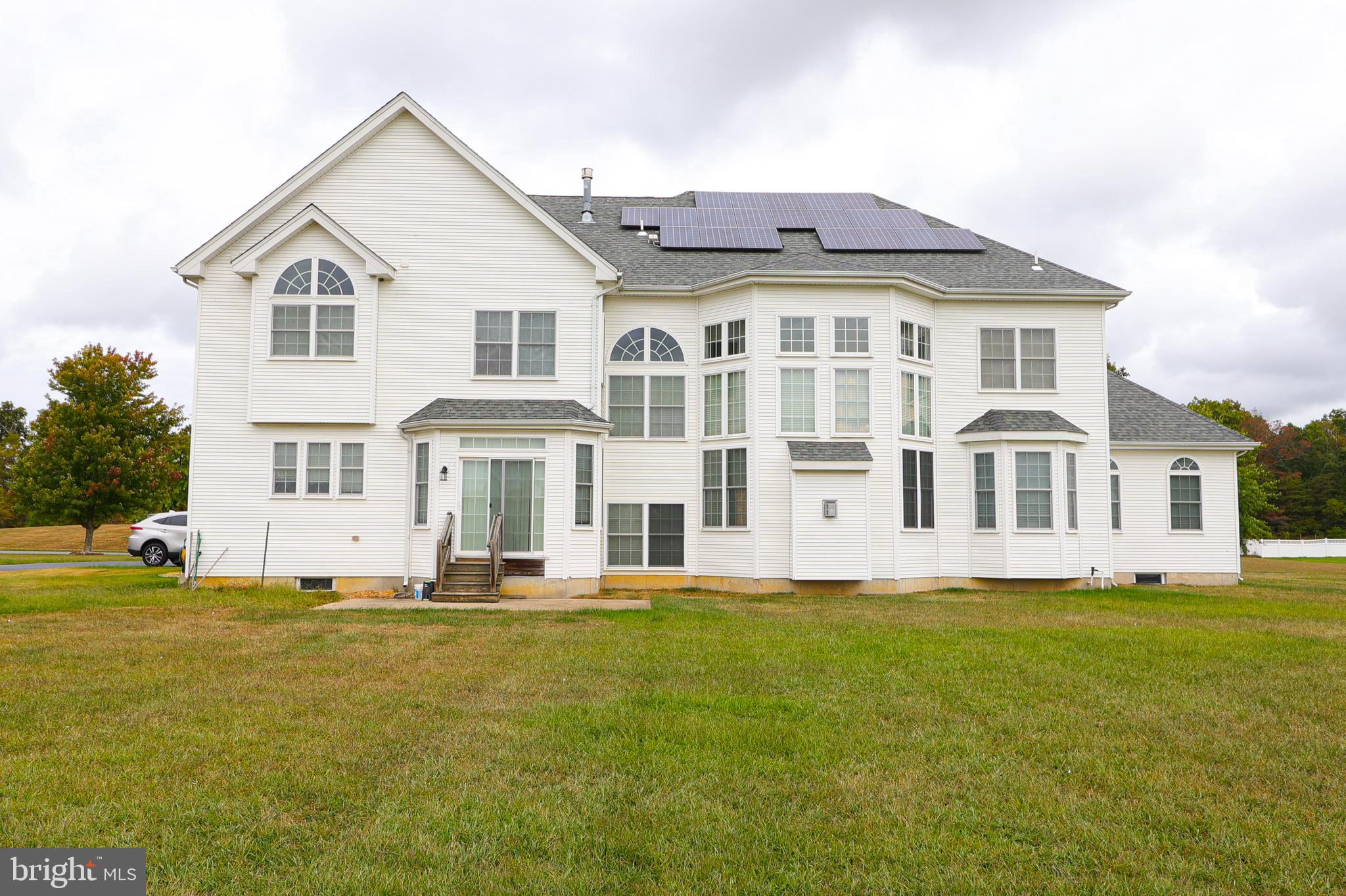 2 Edgewood Drive Pittsgrove, NJ 08318 - Photo 3 of 78 a front view of a house with a yard