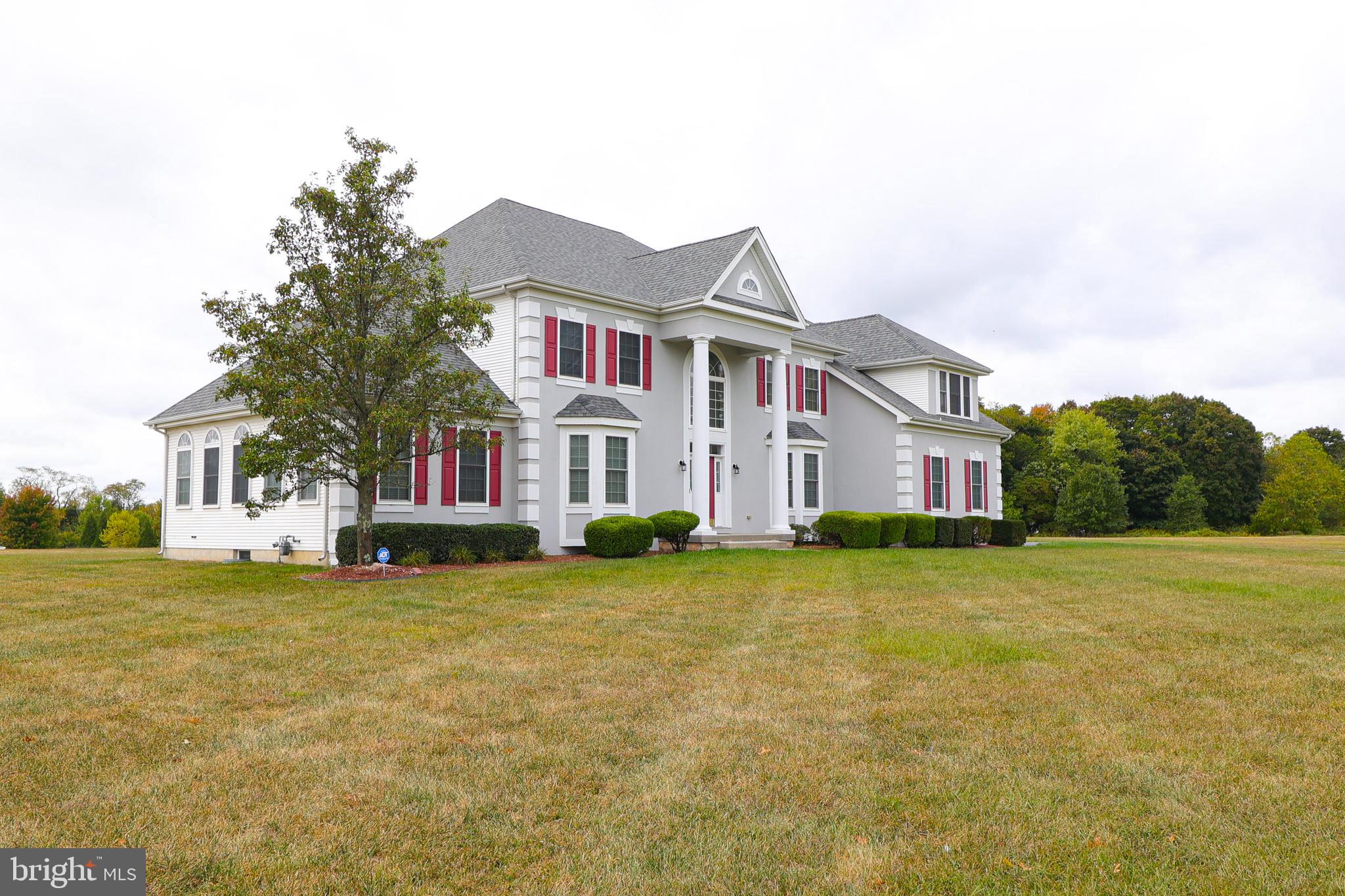 2 Edgewood Drive Pittsgrove, NJ 08318 - Photo 4 of 78 a view of a brick house with a big yard and large trees