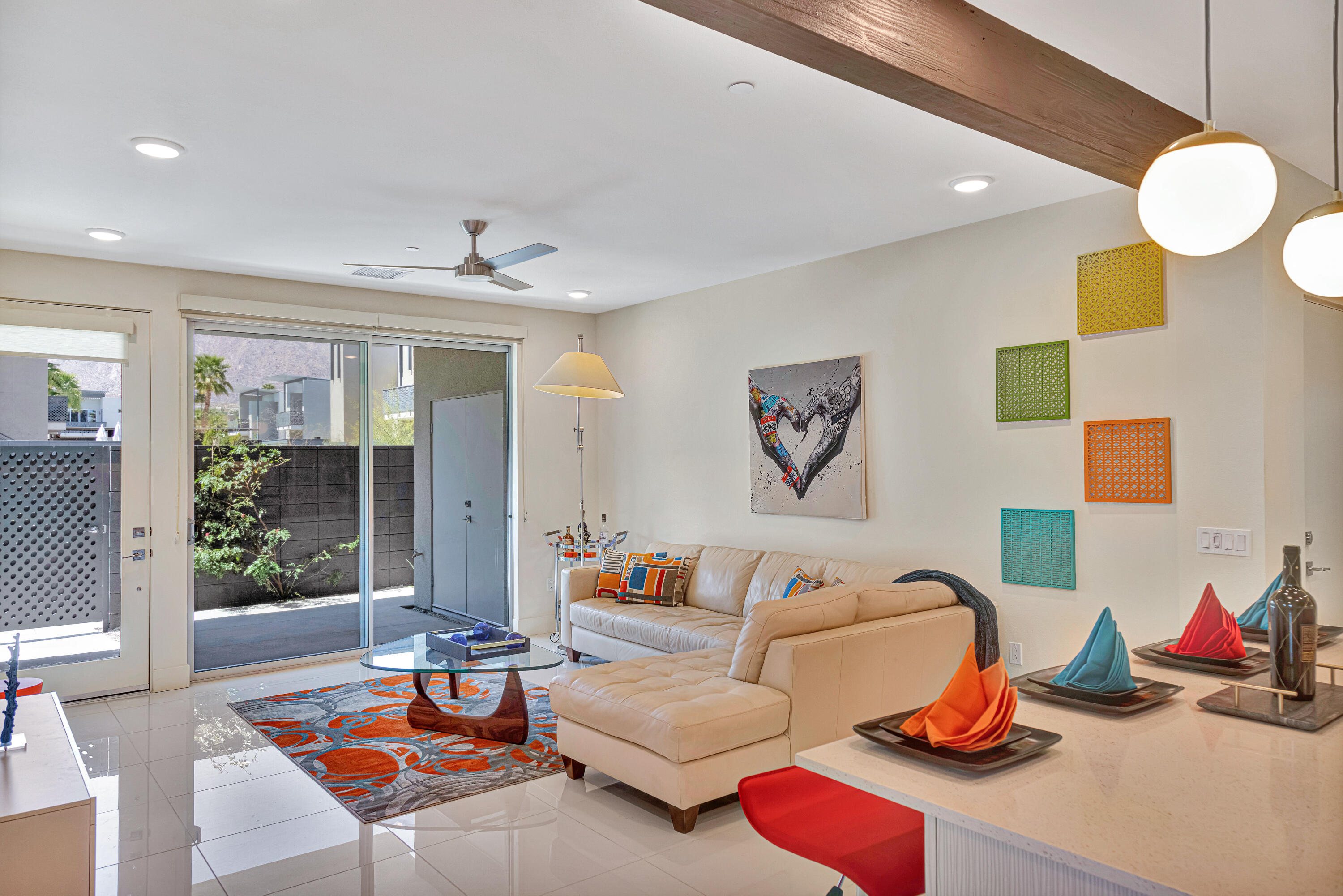 a living room with furniture kitchen and a table