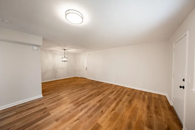 a view of room with wooden floor
