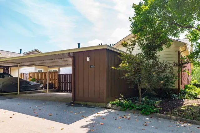 a view of an empty room with wooden walls