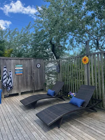a view of a wooden deck with a bench