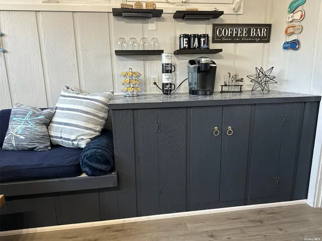 a kitchen with a refrigerator and a stove