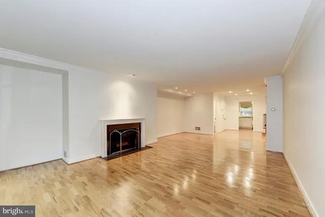 a view of an empty room and fire place