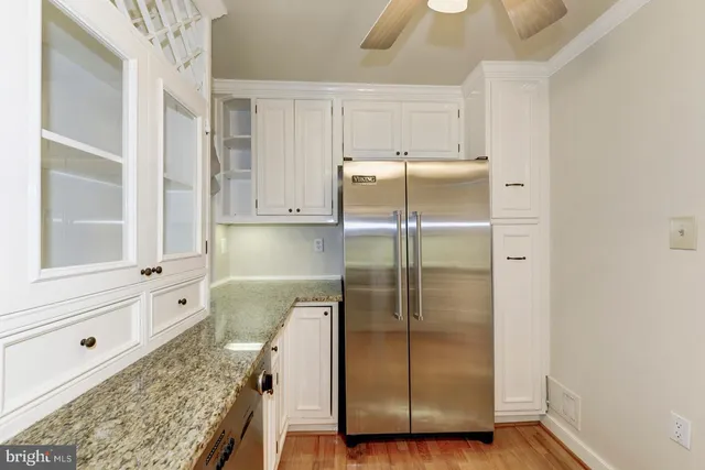 a bathroom with a tub shower and sink