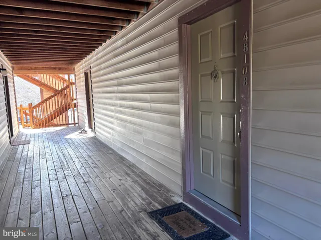 a view of backyard with wooden floor