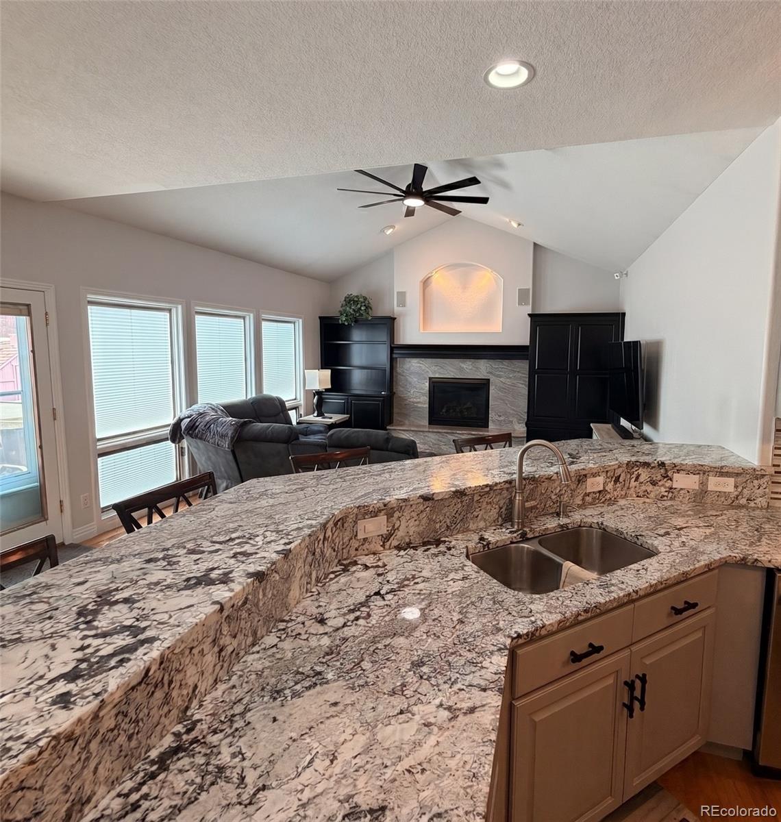 17900 County Road 5 Berthoud, CO 80513 - Photo 11 of 21 a kitchen with kitchen island granite countertop a sink stainless steel appliances and cabinets