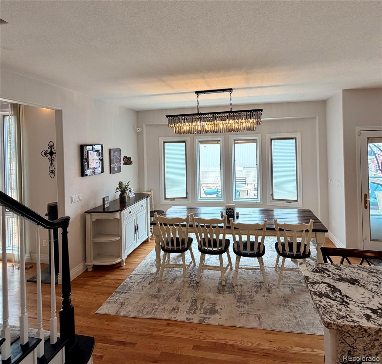 17900 County Road 5 Berthoud, CO 80513 - Photo 14 of 21 a view of a dining room with furniture window and wooden floor