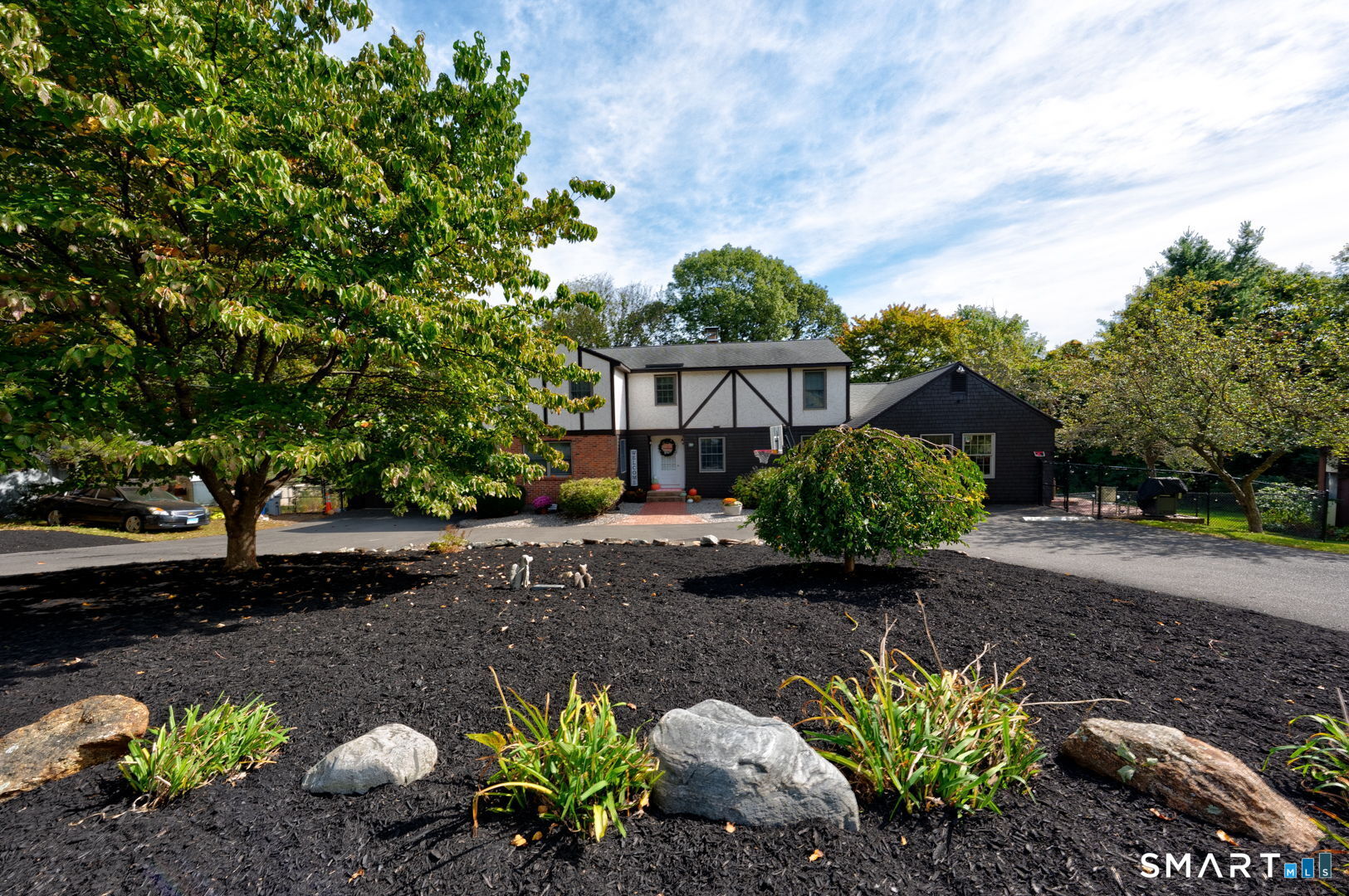 38 Eastwood Road Bristol, CT 06010 - Photo 1 of 40 a view of a garden with a flower in a garden