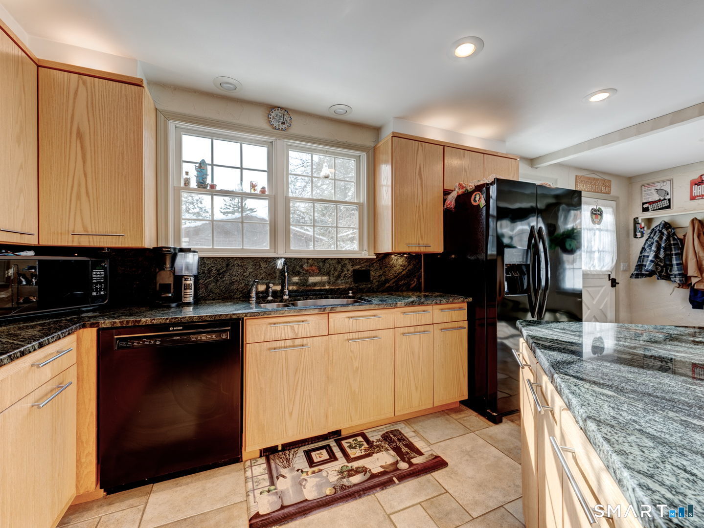 38 Eastwood Road Bristol, CT 06010 - Photo 11 of 40 a kitchen with a stove a sink and a refrigerator