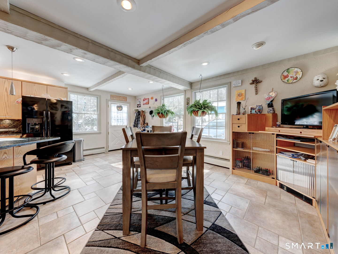 38 Eastwood Road Bristol, CT 06010 - Photo 15 of 40 a dining room with furniture and wooden floor