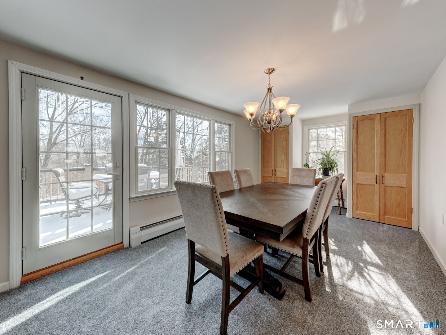 38 Eastwood Road Bristol, CT 06010 - Photo 17 of 40 a dining room with furniture a chandelier and window