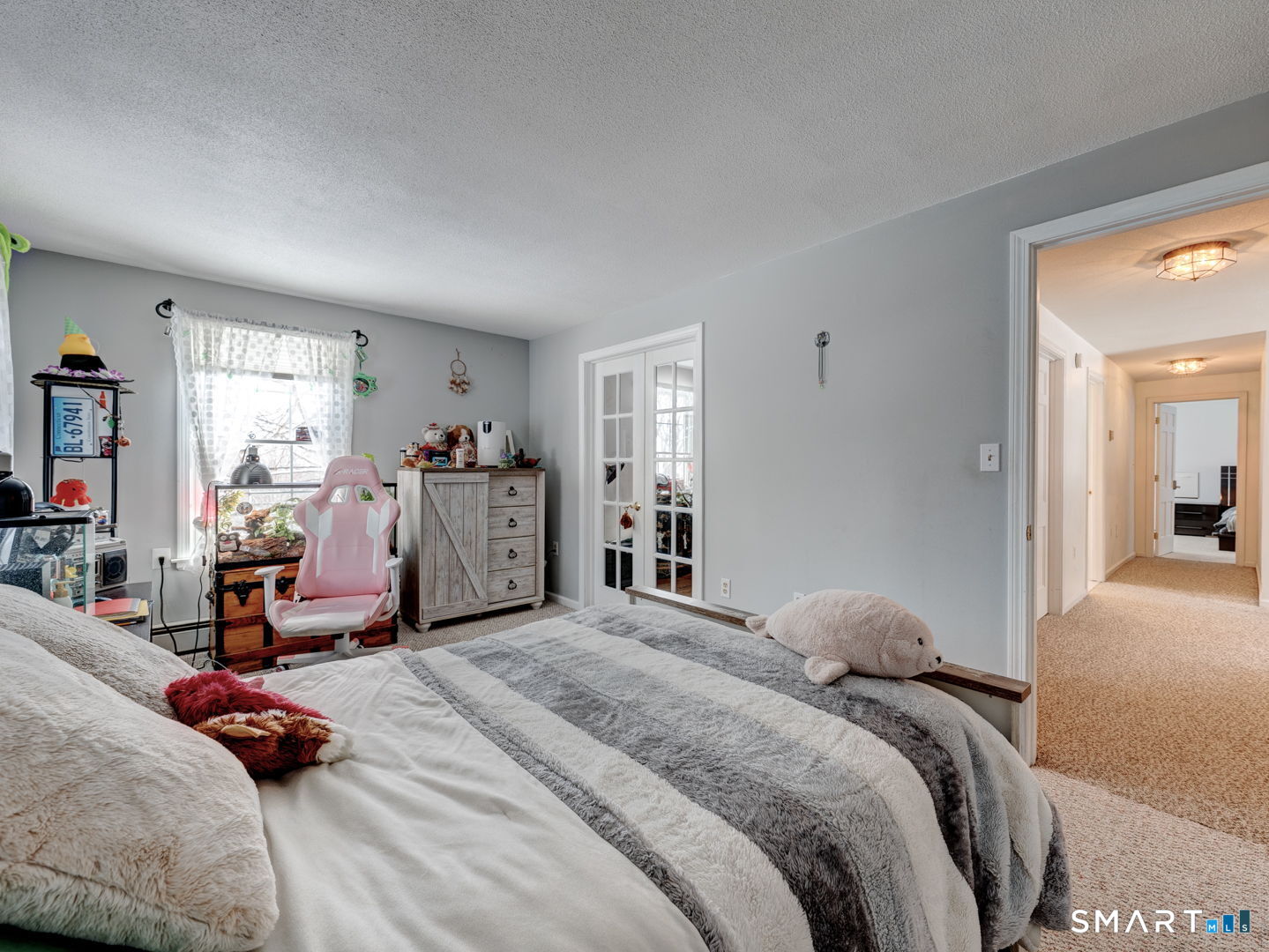 38 Eastwood Road Bristol, CT 06010 - Photo 29 of 40 a bedroom with a bed and a large mirror