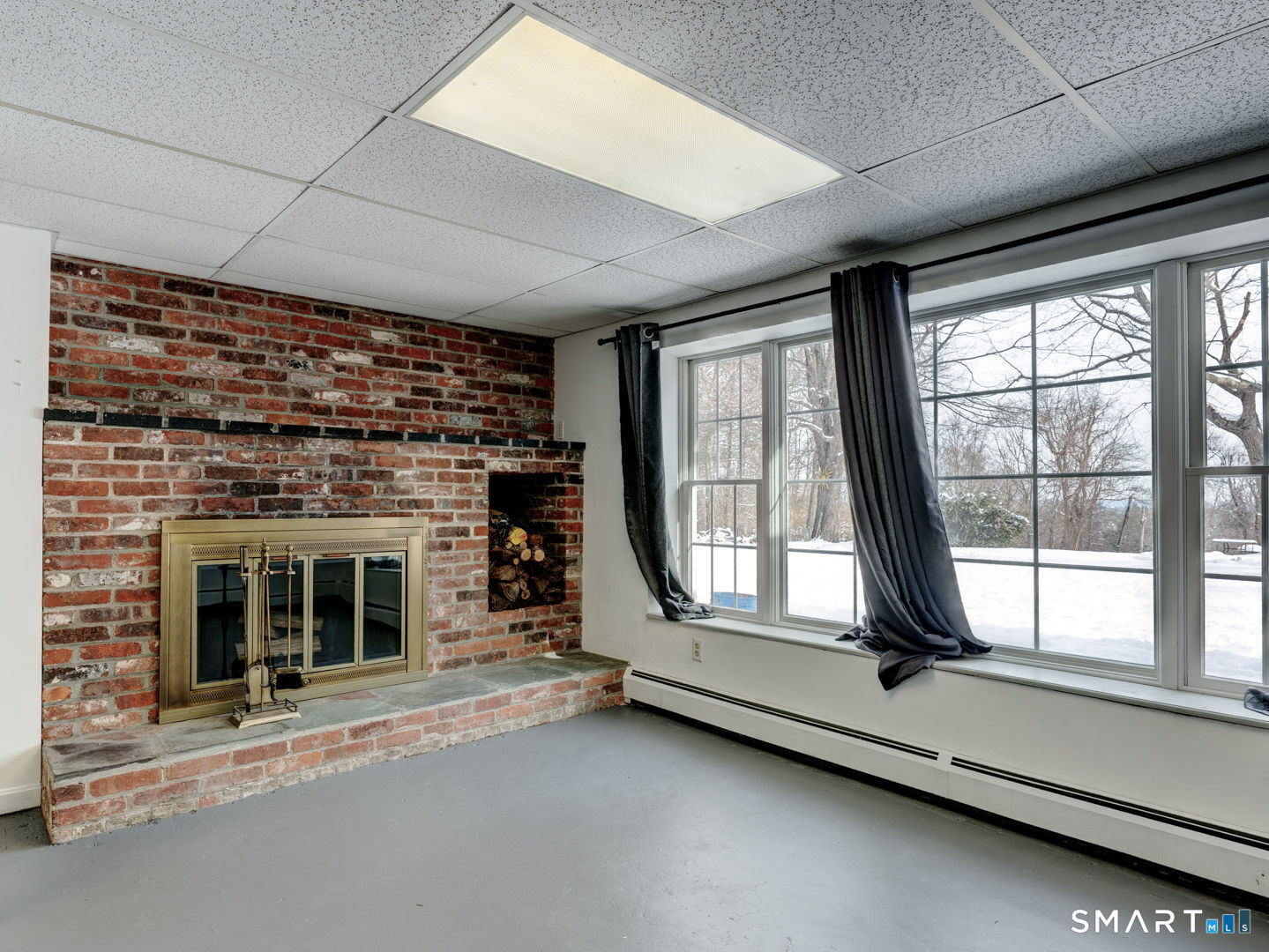 38 Eastwood Road Bristol, CT 06010 - Photo 33 of 40 a living room with fireplace furniture and a large window