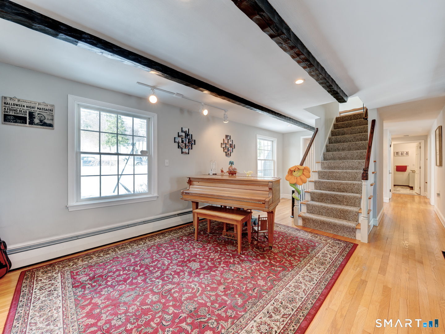 38 Eastwood Road Bristol, CT 06010 - Photo 6 of 40 a room with stairs and a rug