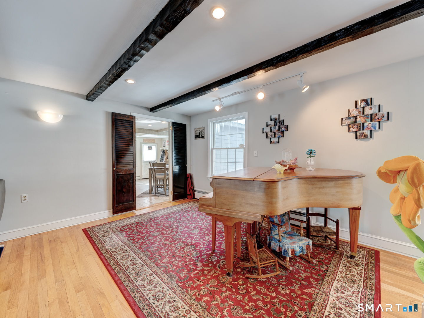 38 Eastwood Road Bristol, CT 06010 - Photo 7 of 40 a living room with dining room and wooden floor