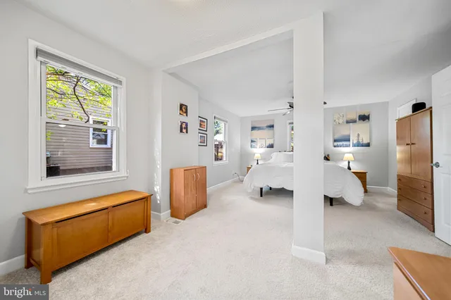 a livingroom with furniture and a wooden floor