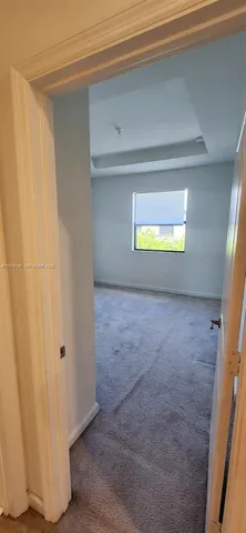 a bathroom with a sink mirror vanity and toilet