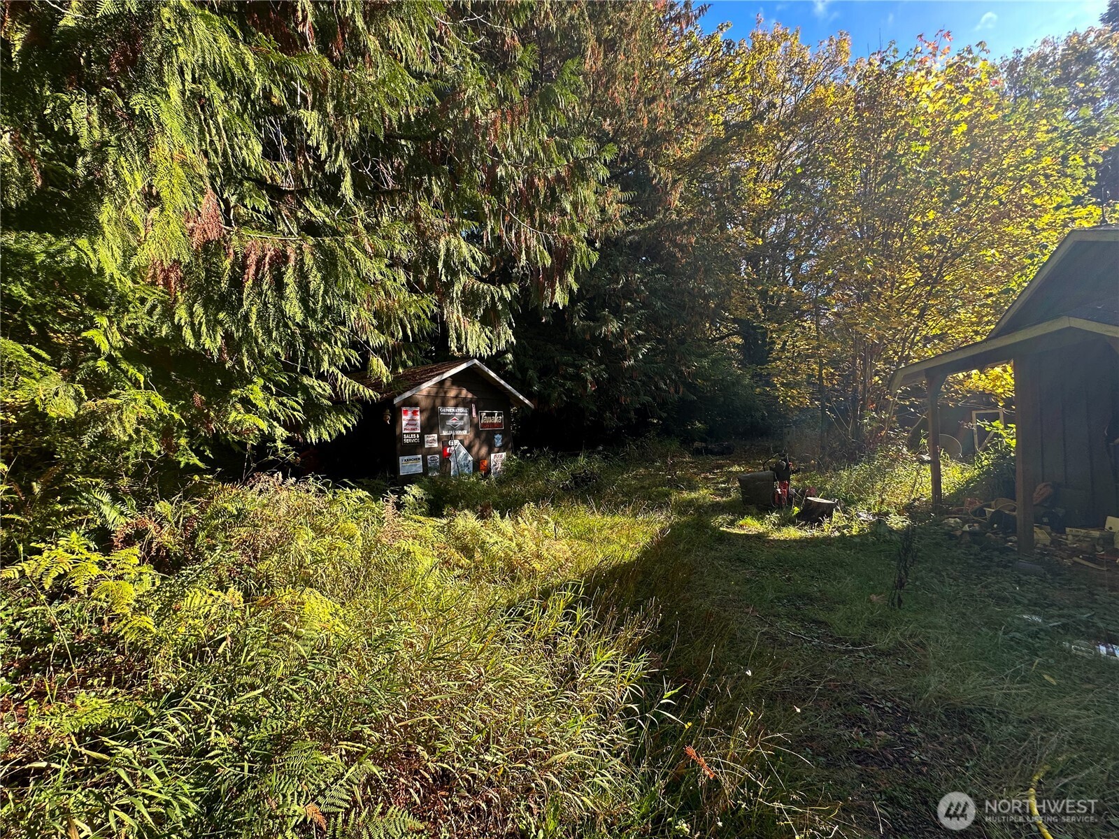 490 West Maple Rock Road Matlock, WA 98560 - Photo 8 of 20 a backyard of a house with a yard and outdoor seating
