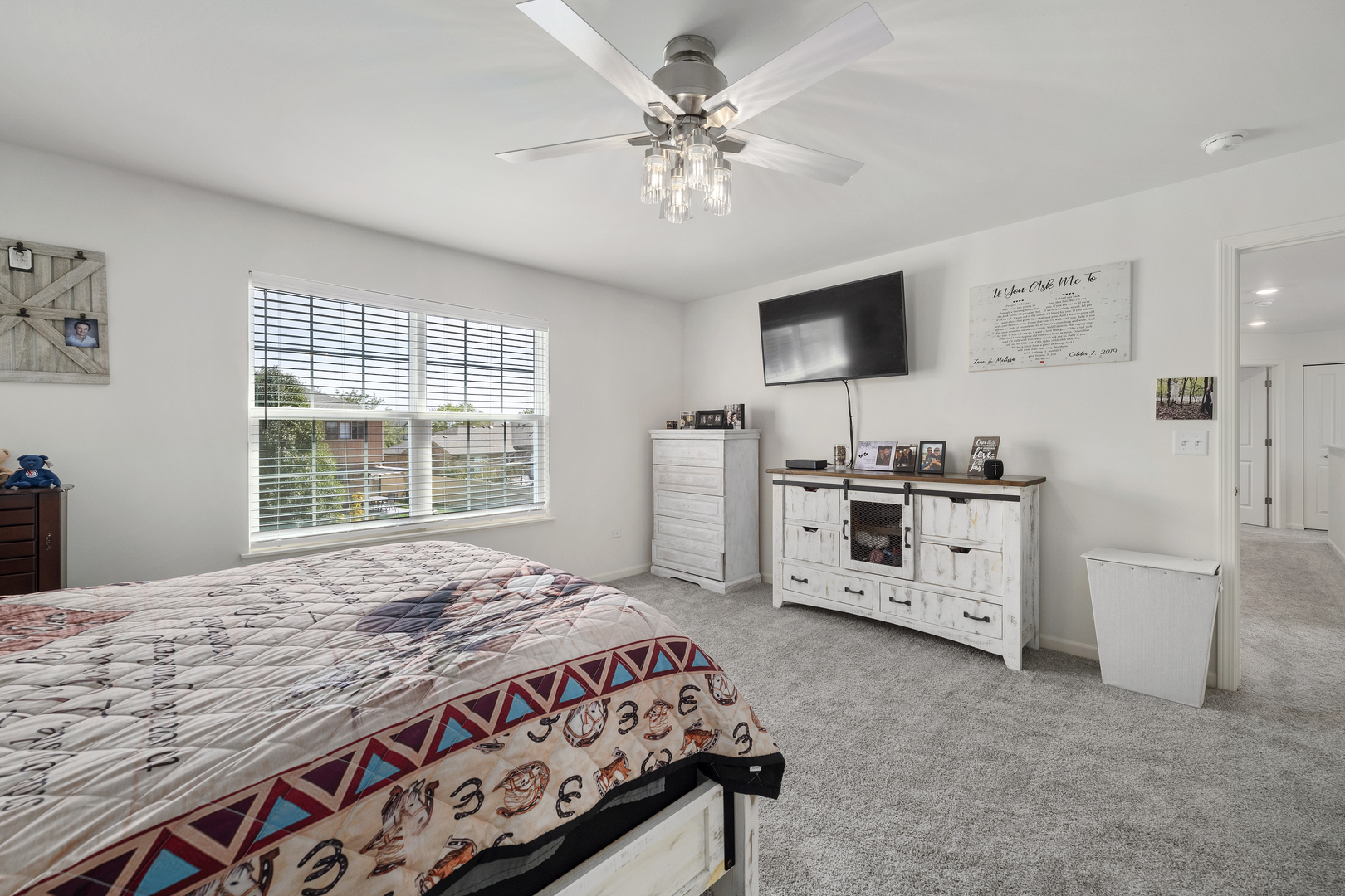 704 Long Ridge Trail Minooka, IL 60447 - Photo 21 of 33 a bedroom with a bed and a flat tv screen in it