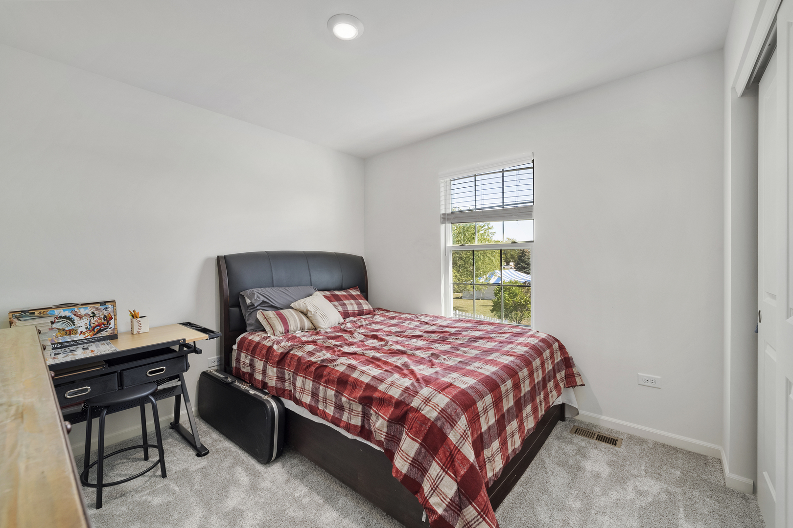 704 Long Ridge Trail Minooka, IL 60447 - Photo 24 of 33 a bedroom with a bed and a window