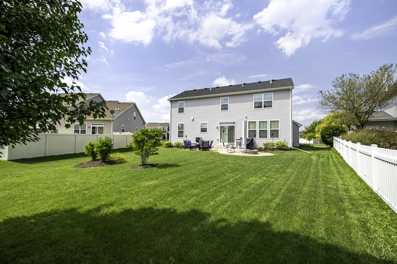 704 Long Ridge Trail Minooka, IL 60447 - Photo 30 of 33 a view of a house with backyard and porch