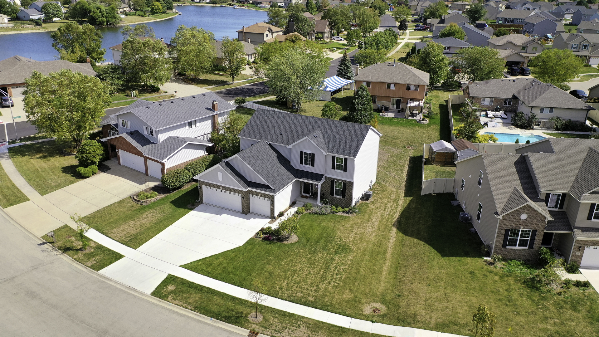 704 Long Ridge Trail Minooka, IL 60447 - Photo 31 of 33 an aerial view of residential houses with outdoor space and parking