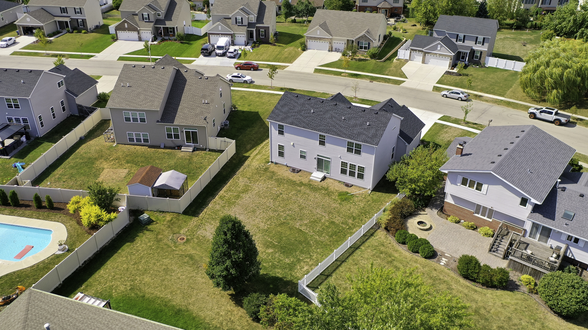 704 Long Ridge Trail Minooka, IL 60447 - Photo 32 of 33 an aerial view of a swimming pool with outdoor seating
