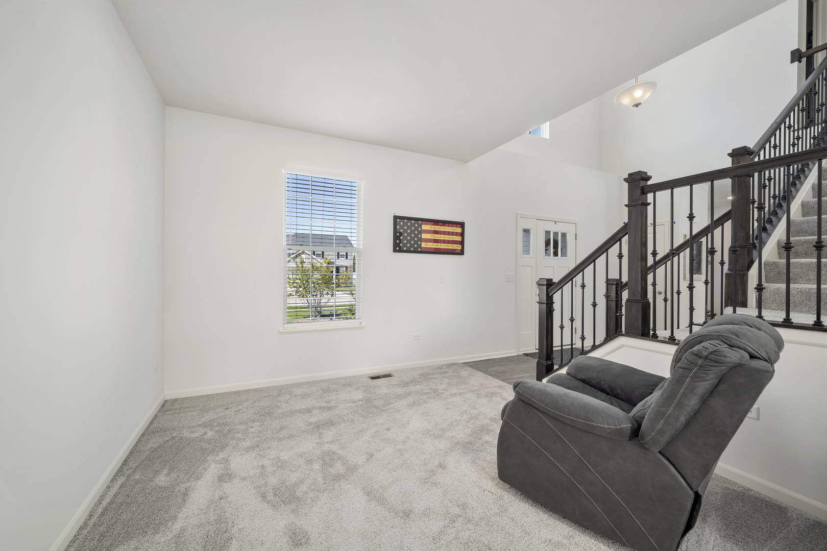 704 Long Ridge Trail Minooka, IL 60447 - Photo 6 of 33 a living room with furniture or stairs and a window