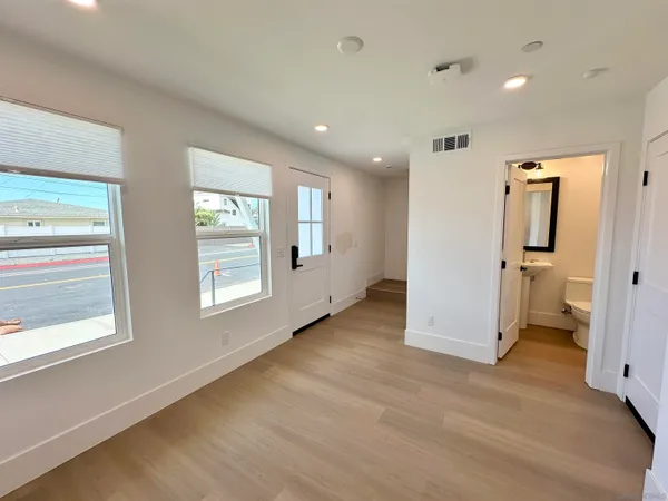 a view of entryway with wooden floor and a window