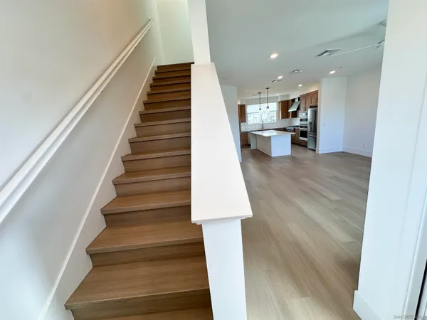 a view of entryway and kitchen