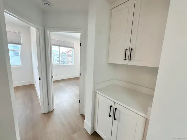 a view of storage and utility room with closet