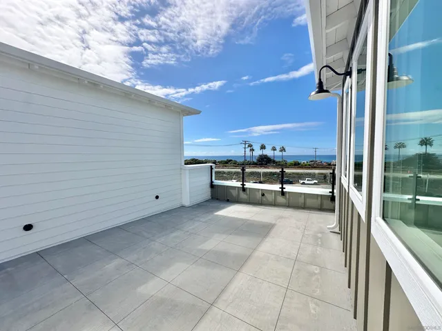 a view of a kitchen with outdoor kitchen