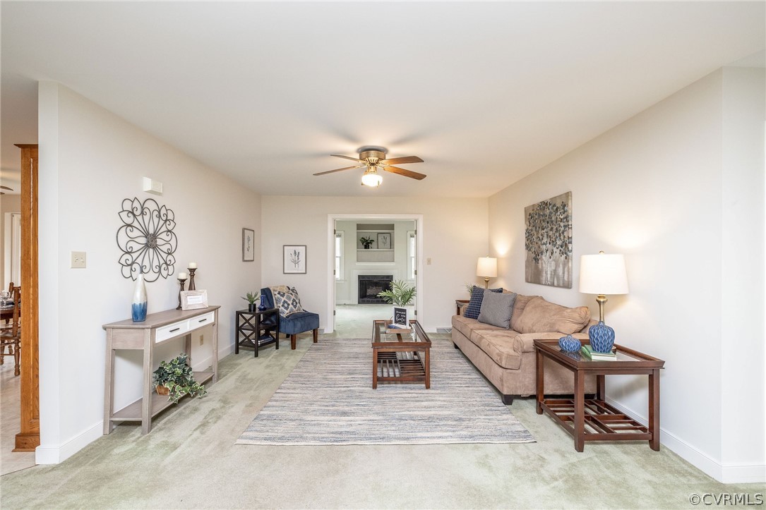 16004 Parsons Road Beaverdam, VA 23015 - Photo 11 of 47 a living room with furniture and a chandelier