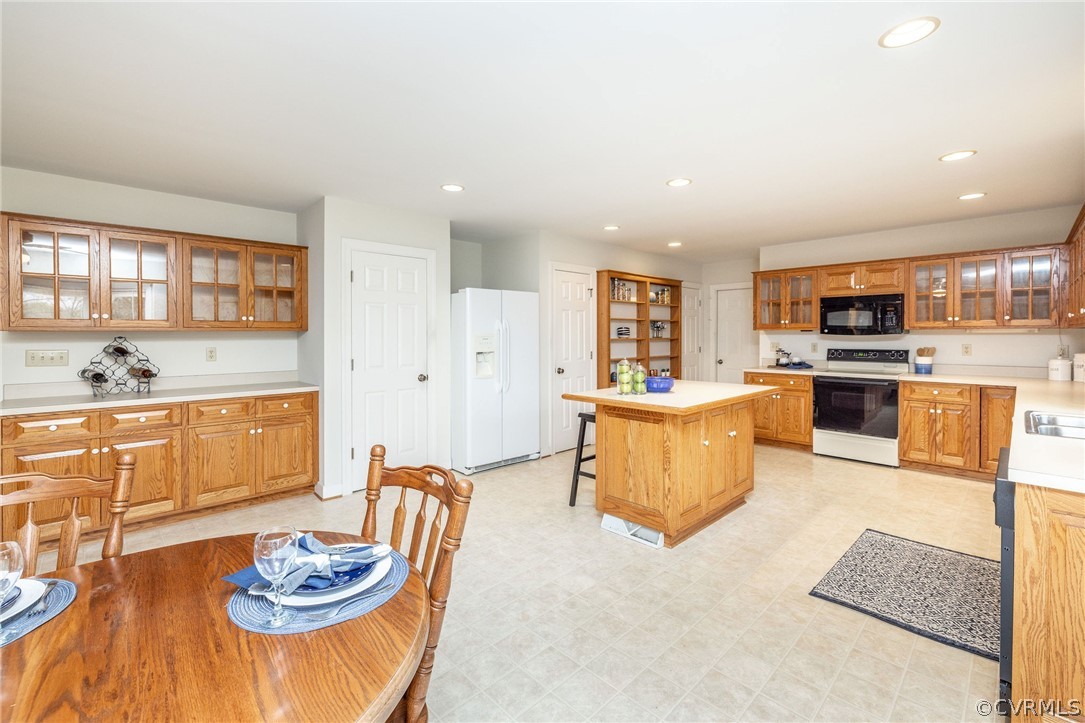 16004 Parsons Road Beaverdam, VA 23015 - Photo 16 of 47 a living room with stainless steel appliances kitchen island granite countertop furniture and a kitchen view