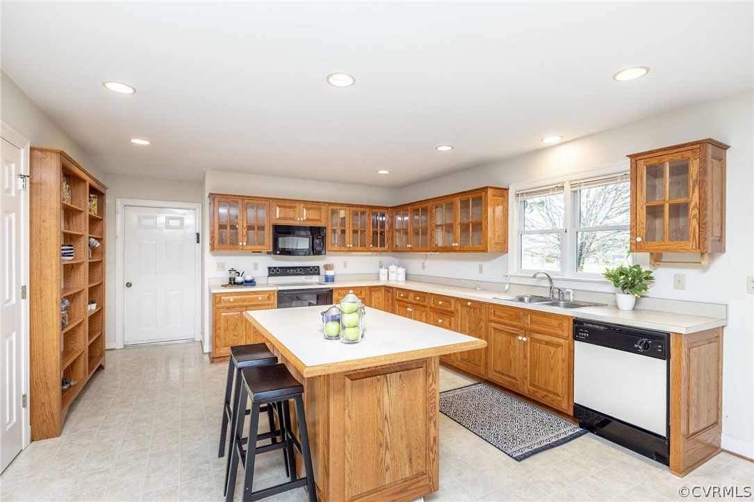 16004 Parsons Road Beaverdam, VA 23015 - Photo 17 of 47 a large kitchen with a table and chairs in it