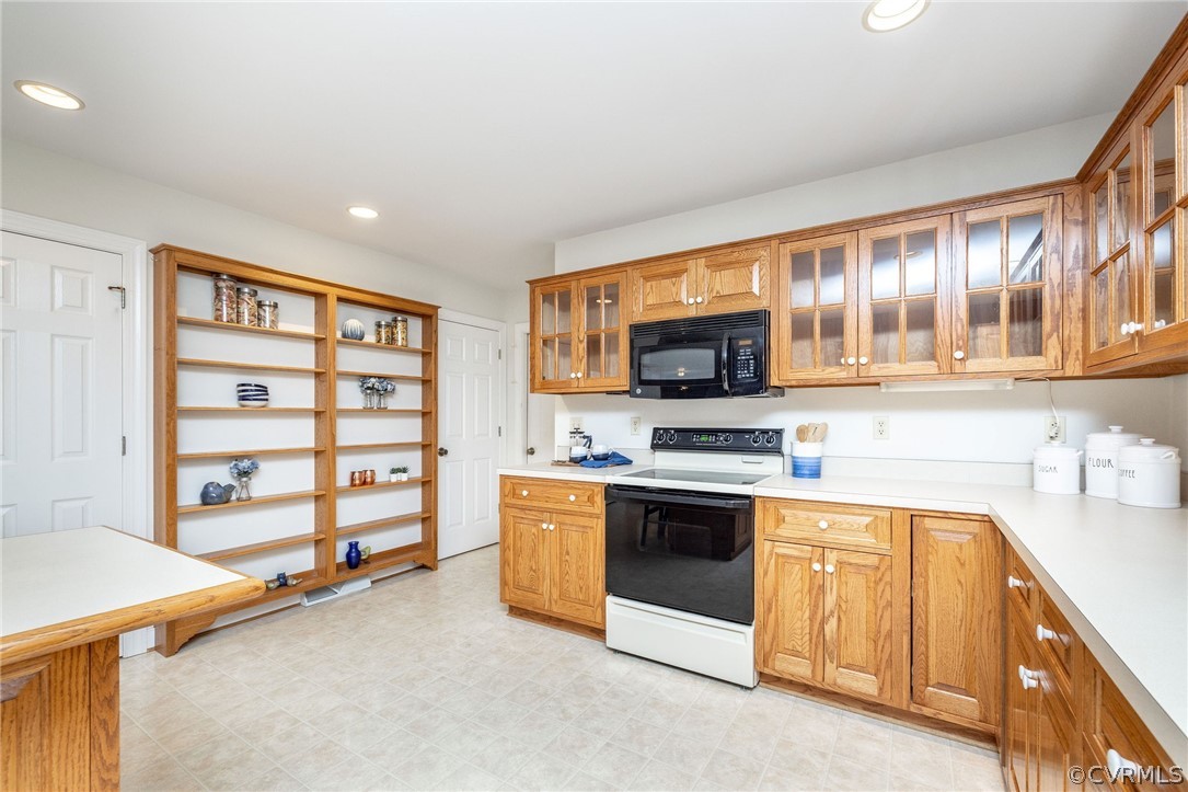 16004 Parsons Road Beaverdam, VA 23015 - Photo 19 of 47 a kitchen with stainless steel appliances a stove and a sink