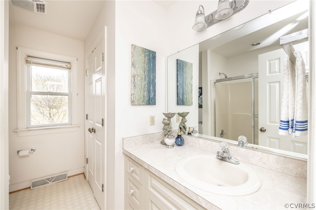 16004 Parsons Road Beaverdam, VA 23015 - Photo 25 of 47 a bathroom with a sink and a mirror