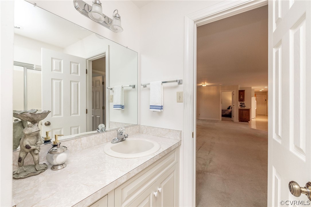 16004 Parsons Road Beaverdam, VA 23015 - Photo 26 of 47 a en suite bathroom with double sink and a mirror