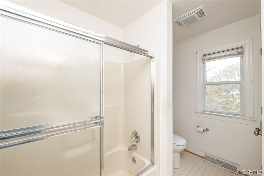 16004 Parsons Road Beaverdam, VA 23015 - Photo 27 of 47 a bathroom with a shower a toilet and a window
