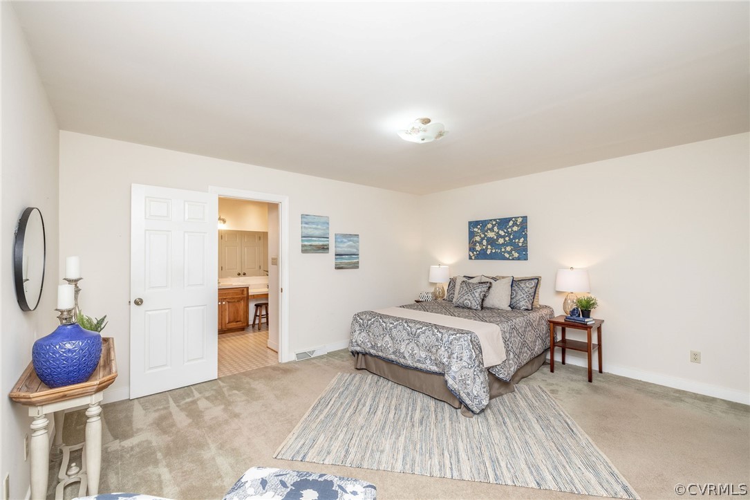 16004 Parsons Road Beaverdam, VA 23015 - Photo 31 of 47 a bedroom with a bed and cabinets