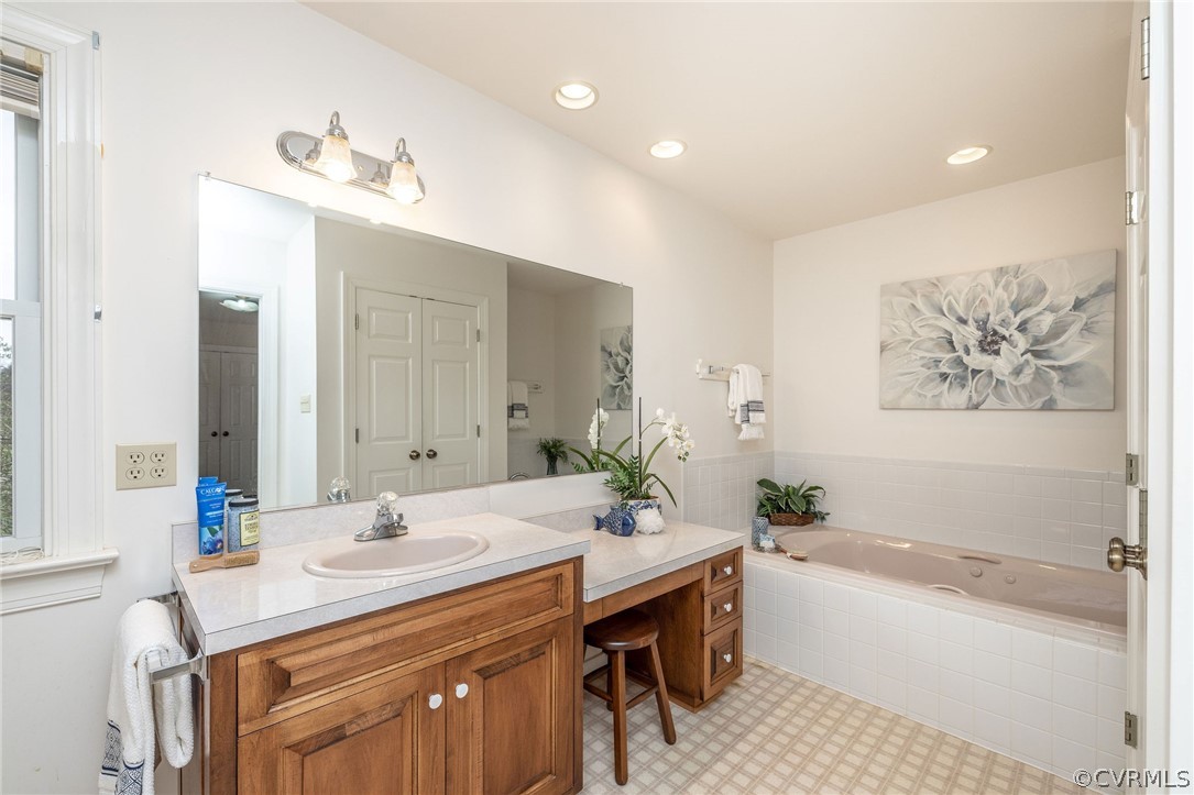 16004 Parsons Road Beaverdam, VA 23015 - Photo 33 of 47 a bathroom with a tub a sink and a mirror