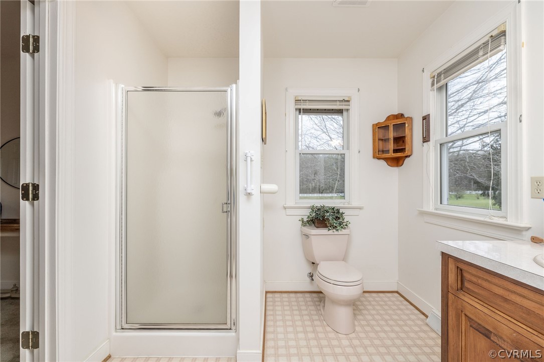 16004 Parsons Road Beaverdam, VA 23015 - Photo 35 of 47 a bathroom with a toilet a window and tub