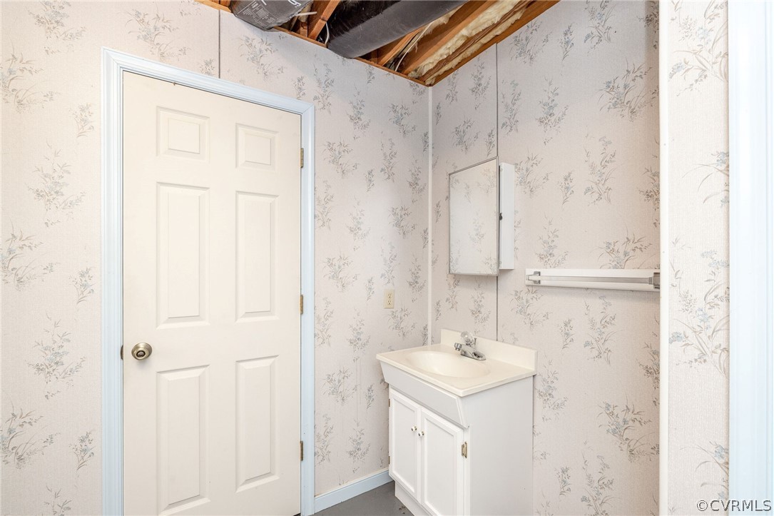 16004 Parsons Road Beaverdam, VA 23015 - Photo 40 of 47 a bathroom with a sink a vanity and a mirror