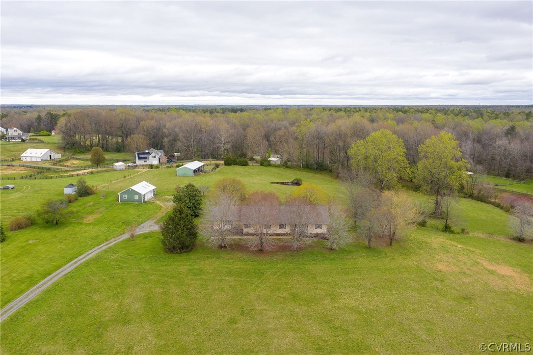 16004 Parsons Road Beaverdam, VA 23015 - Photo 5 of 47 a view of a swimming pool with an outdoor seating and yard