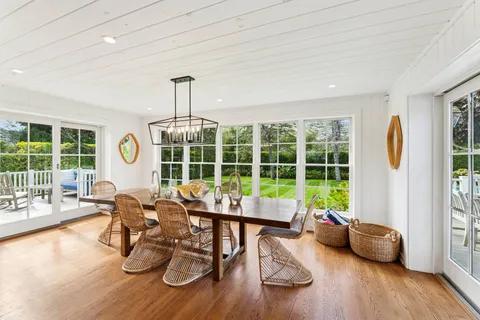 a work room with furniture and a large window