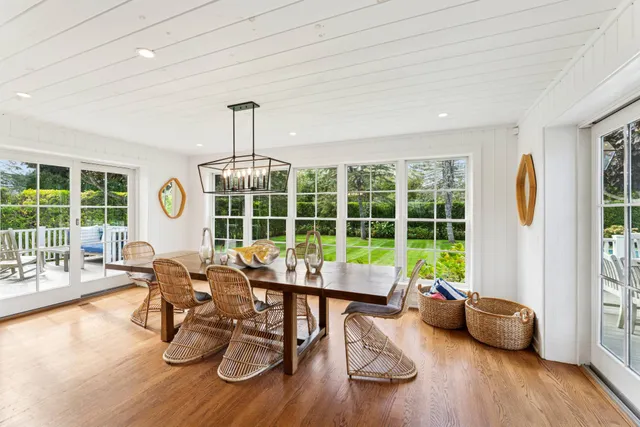 a work room with furniture and a large window