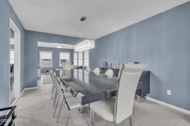 a view of a dining room with furniture and window