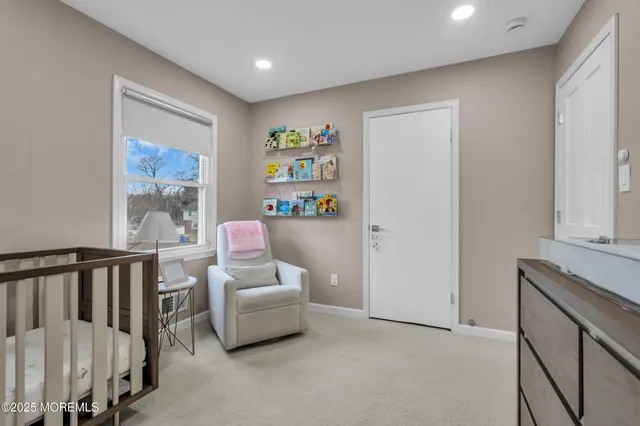 a hallway with furniture and a gate